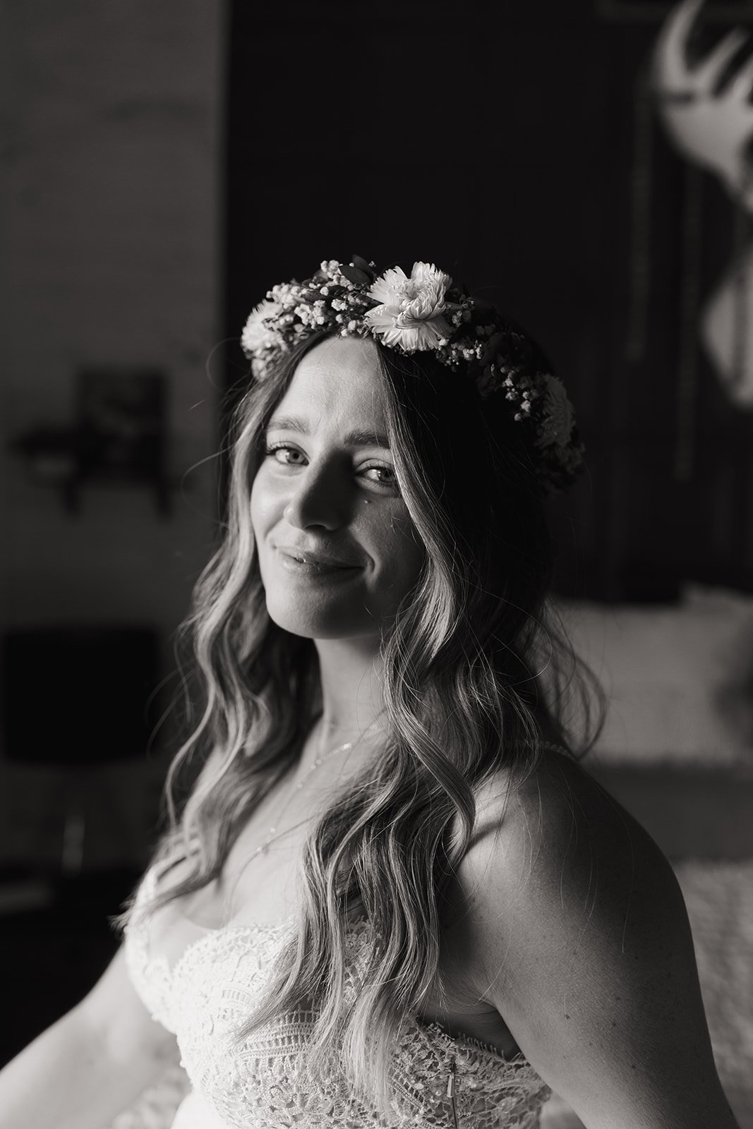 A black and white portrait of Leah getting ready