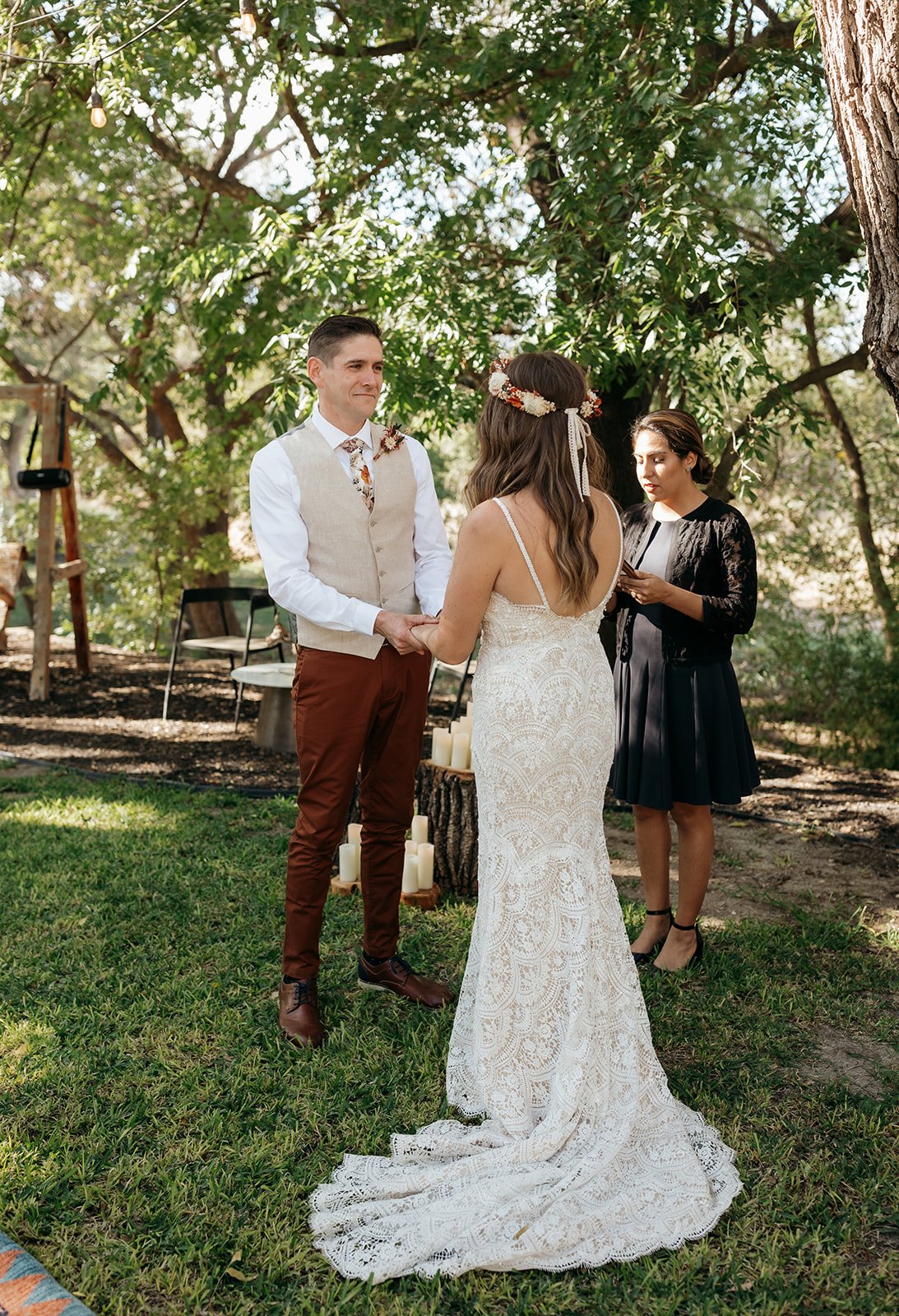 James looks lovingly at Leah during the outdoor wedding ceremony
