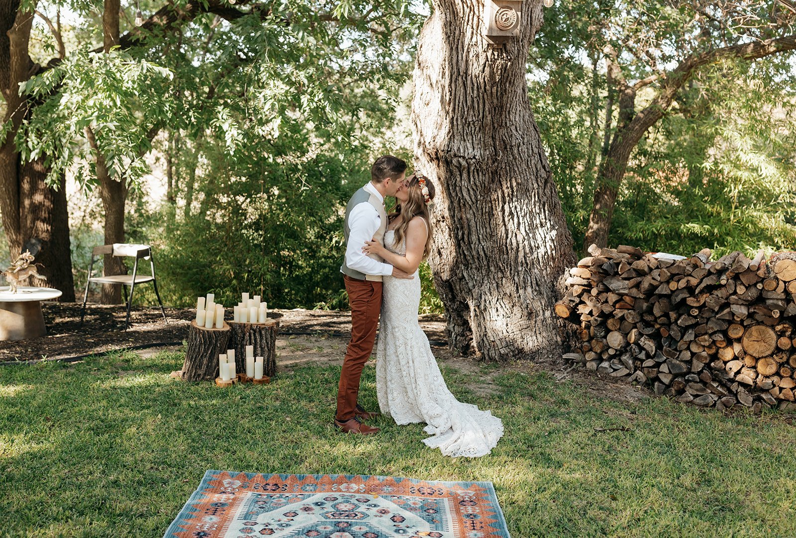 Leah and James share their first kiss as husband and wife under the trees