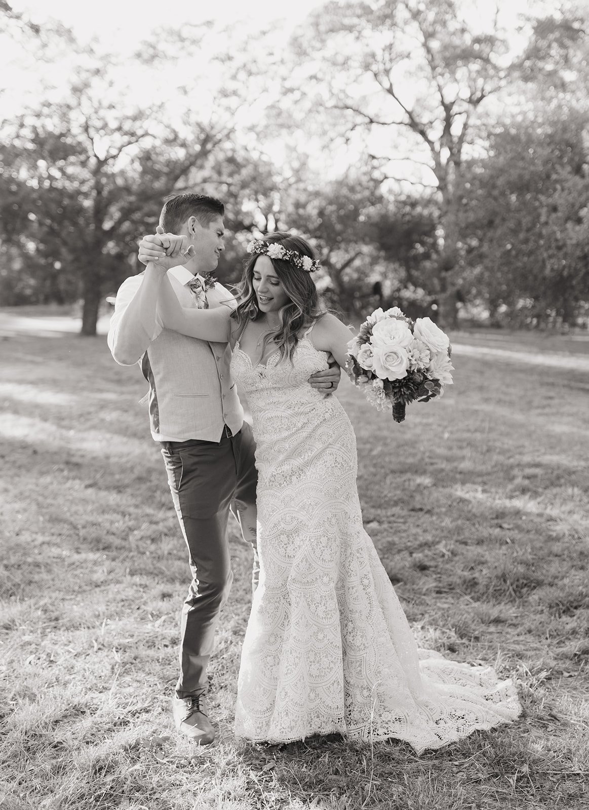 Another black and white photo of the couple dancing and having fun during portraits