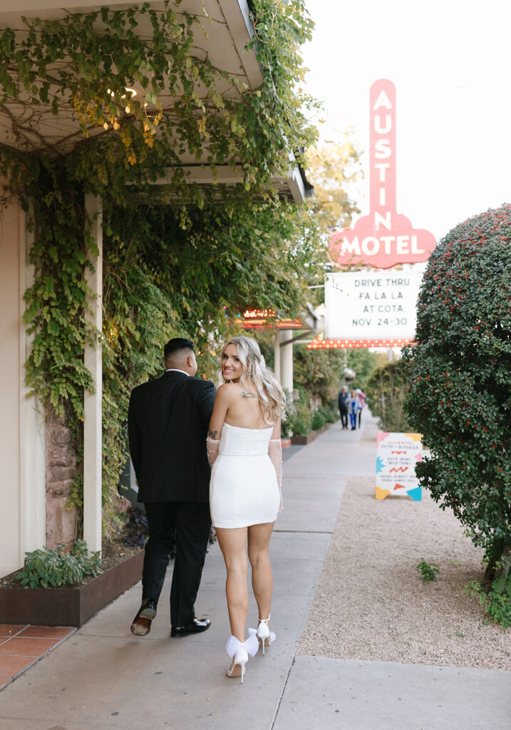 Taking retro and classy engagement photos under the Austin Motel sign on South Congress Avenue