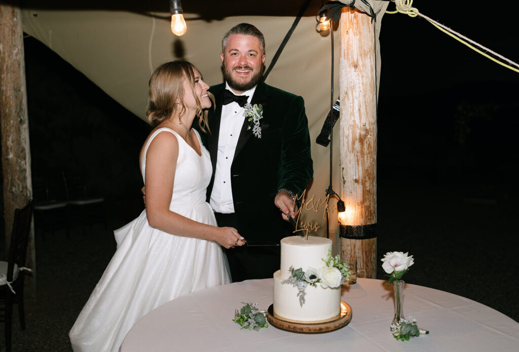 Cinematic and nostalgic cake cutting during their intimate Spring Creek Ranch wedding reception