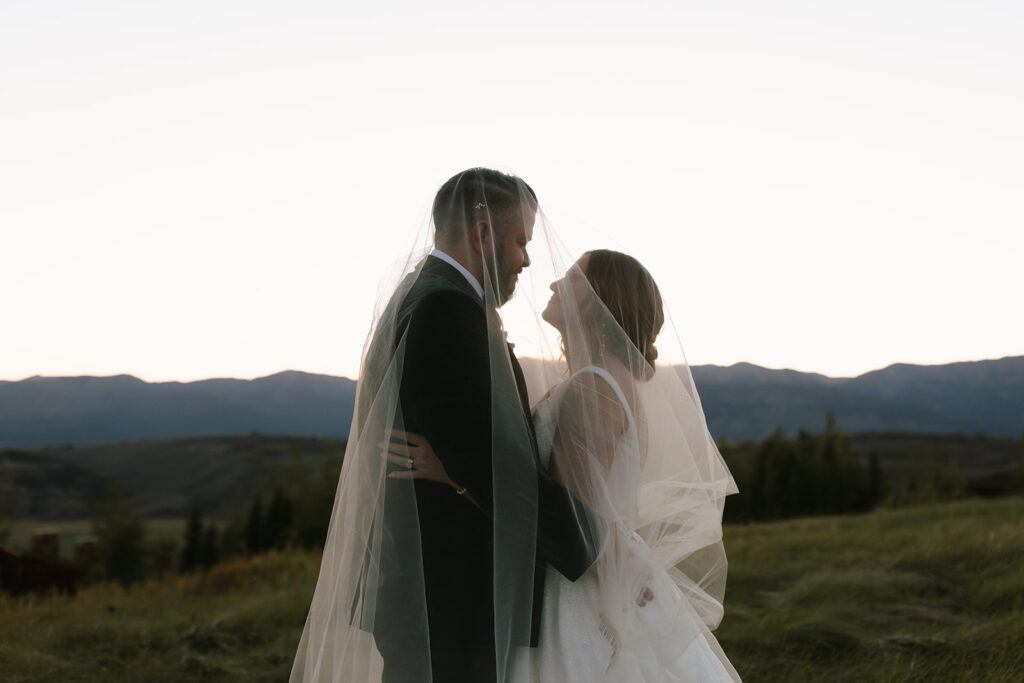 Stunning, candid and cinematic dusk golden hour wedding portraits in Jackson Hole, Wyoming