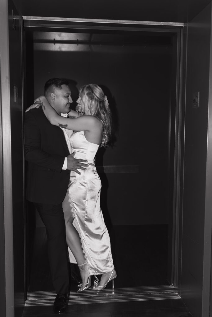 Downtown Austin engagement photos  cozying up in the elevator of South Congress Hotel