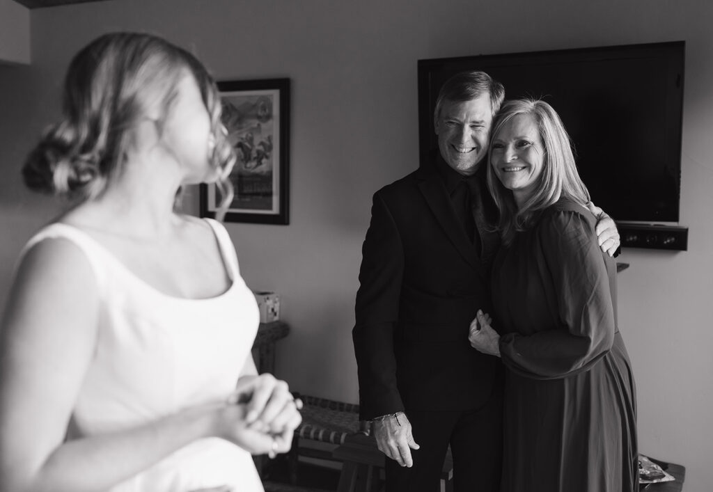 Sweet and emotional first look moments with the bride's mom and dad at Wyoming wedding