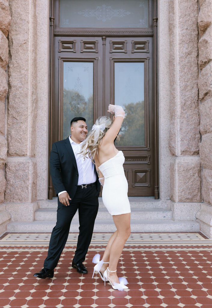Dancing outside the Texas State Capitol building for the downtown Austin engagement photos