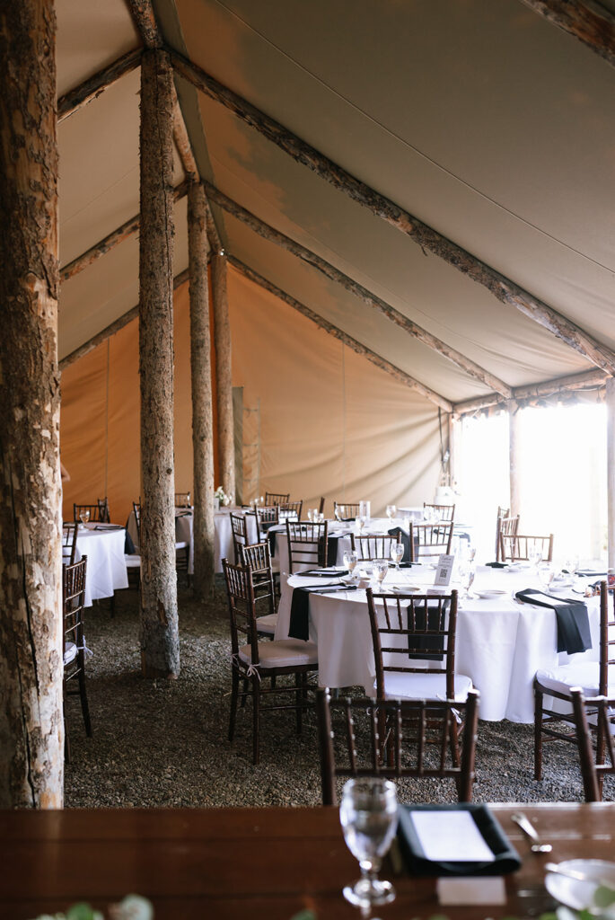 Rustic tent wedding reception at Spring Creek Ranch wedding venue