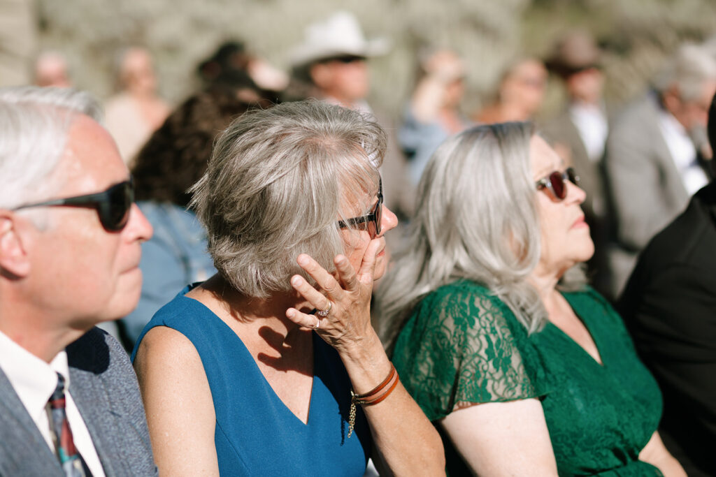 Guests tearing up during the Jackson Hole mountain wedding ceremony