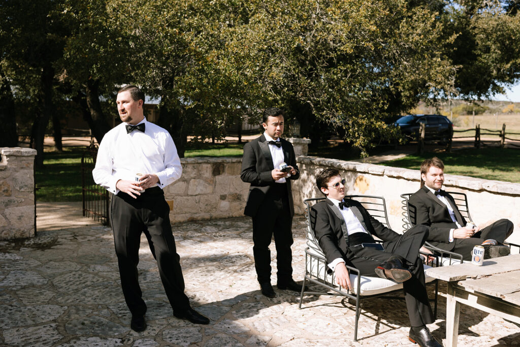 The groomsmen hanging out outside their cottage at Contigo Ranch