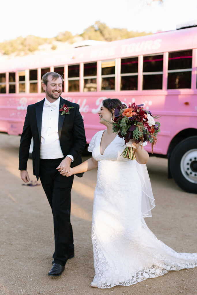 The couple leaving Brook's Bubble Bus Fredericksburg TX which shuttled guests to and from the wedding ceremony and reception at Contigo Ranch