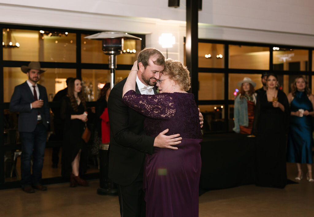 Groom dancing with his mom during the Contigo Ranch wedding reception