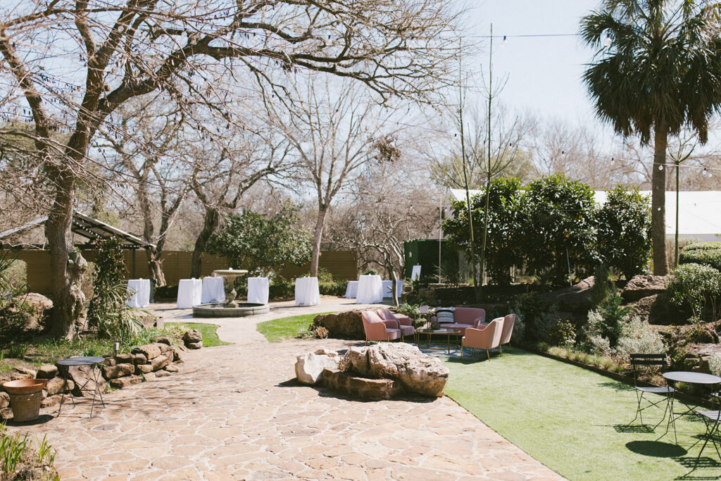 Garden party vibes with outdoor lounging at the Hummingbird House Austin gardens