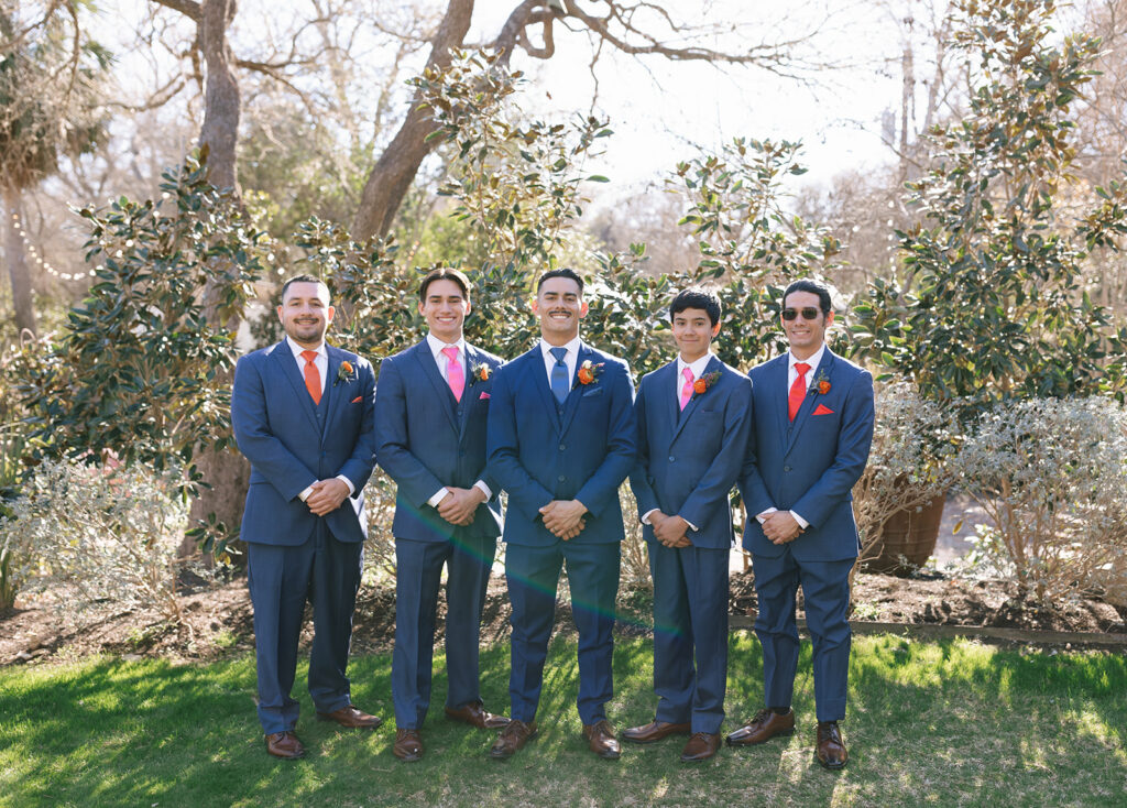 Joshua's portraits with his groomsmen in the gardens at Hummingbird House Austin