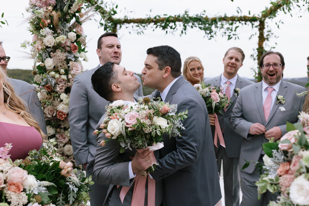 Silly wedding party moments under the chuppah