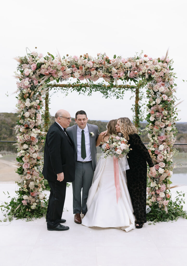 Family and friends wedding portraits under the chuppah