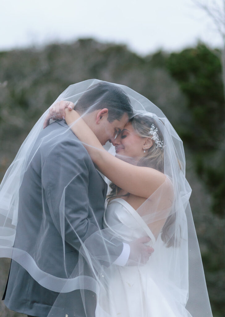 Cool and moody veil wedding portraits on the grounds of The Videre Estate, a Wimberley wedding venue