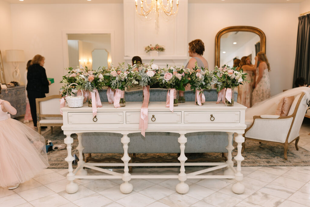 Romantic pink and sky blue accents in the Château getting ready suite at The Videre Estate in Wimberley, TX
