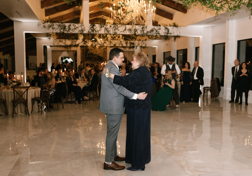 Jordan's first dance with his mom during the winter wedding reception