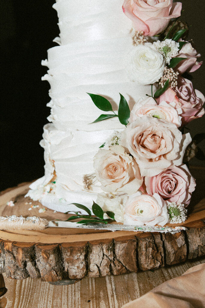 White winter wedding cake cutting detail shot