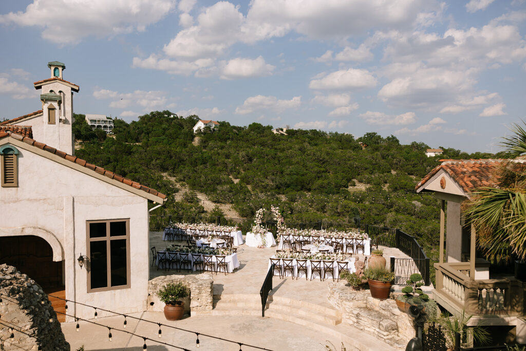 Outdoor wedding reception setup with Austin hill country views at Villa Antonia 