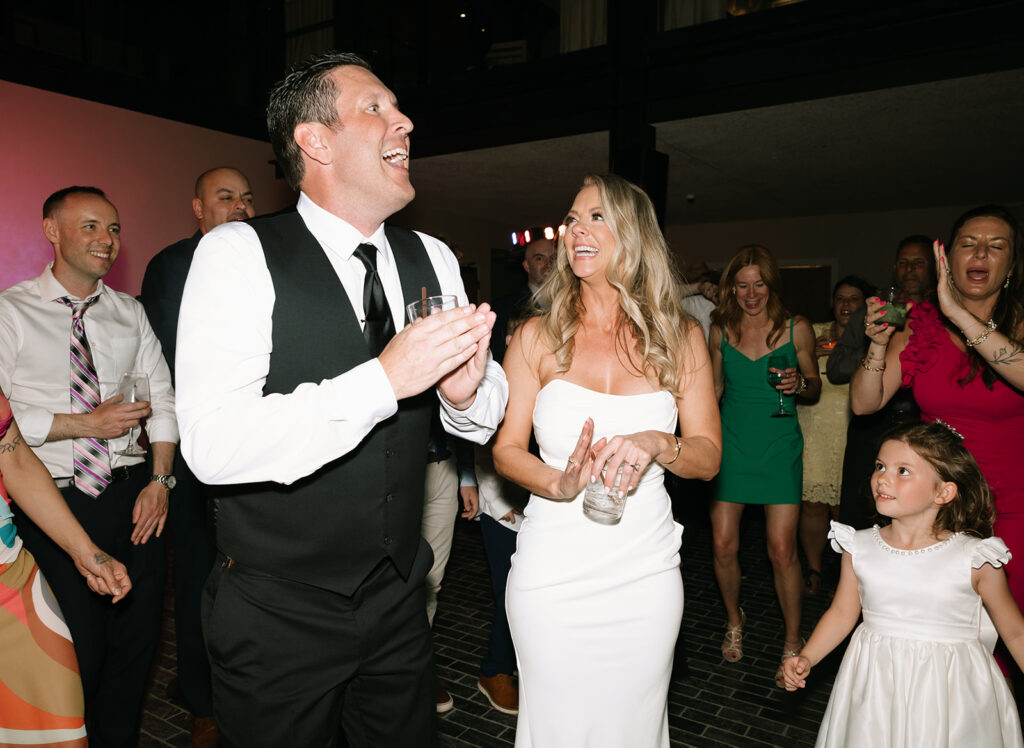 Jessica and Greg laughing and enjoying their reception at Albert Hotel Fredericksburg.