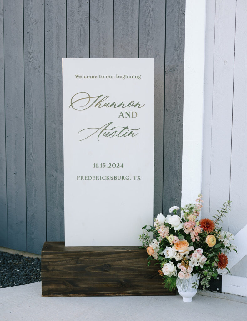 Personalized welcome sign for Shannon and Austin’s wedding day at Swallows Eve, styled with romantic blush and peach florals.