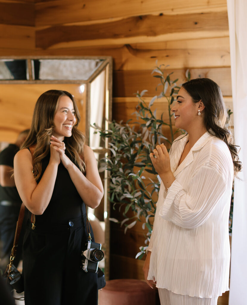 Fredericksburg wedding photographer, Kari, sharing a sweet moment with Shannon while she was getting ready for her Swallows Eve wedding