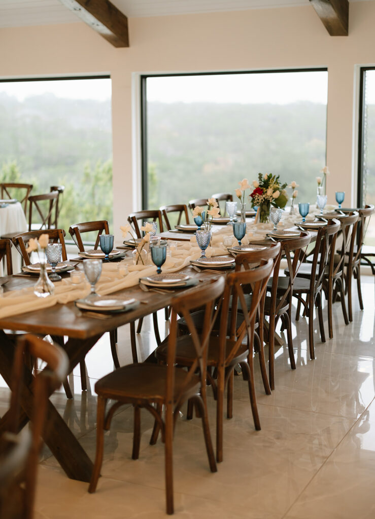 The modern windows at the Videre Estate's indoor wedding reception space with breathtaking views of the surrounding Hill Country in Wimberley Texas